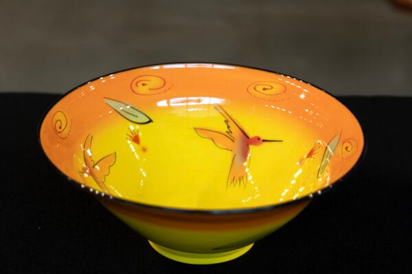 Orange ceramic bowl with hummingbirds by Natalie Warrens